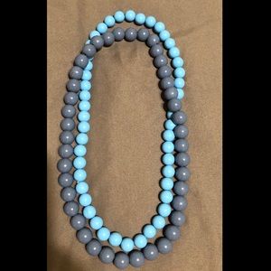 2 separate blue necklaces